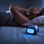 woman in bed cant sleep