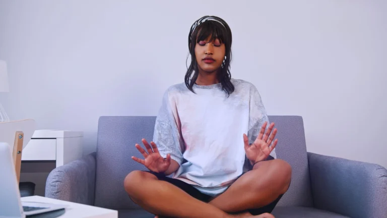 WOMAN SITS LOOKING TO MEDITATE scaled