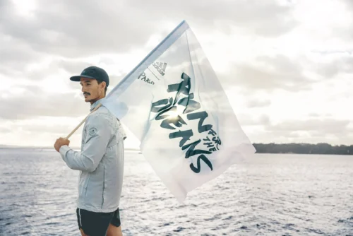 a man bearing the parley oceans flag