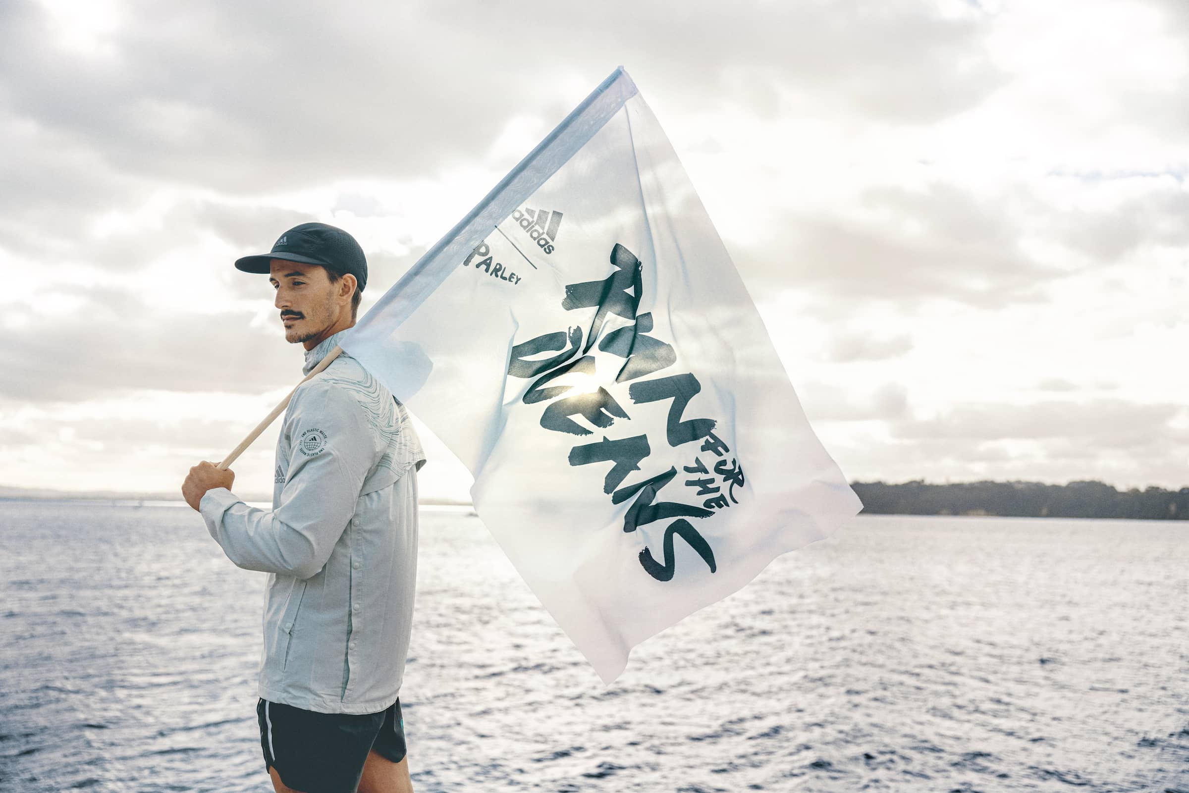 A man bearing the parley oceans flag