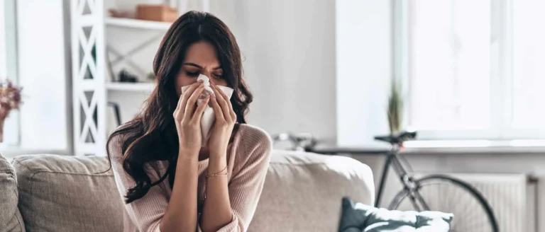woman sneezing