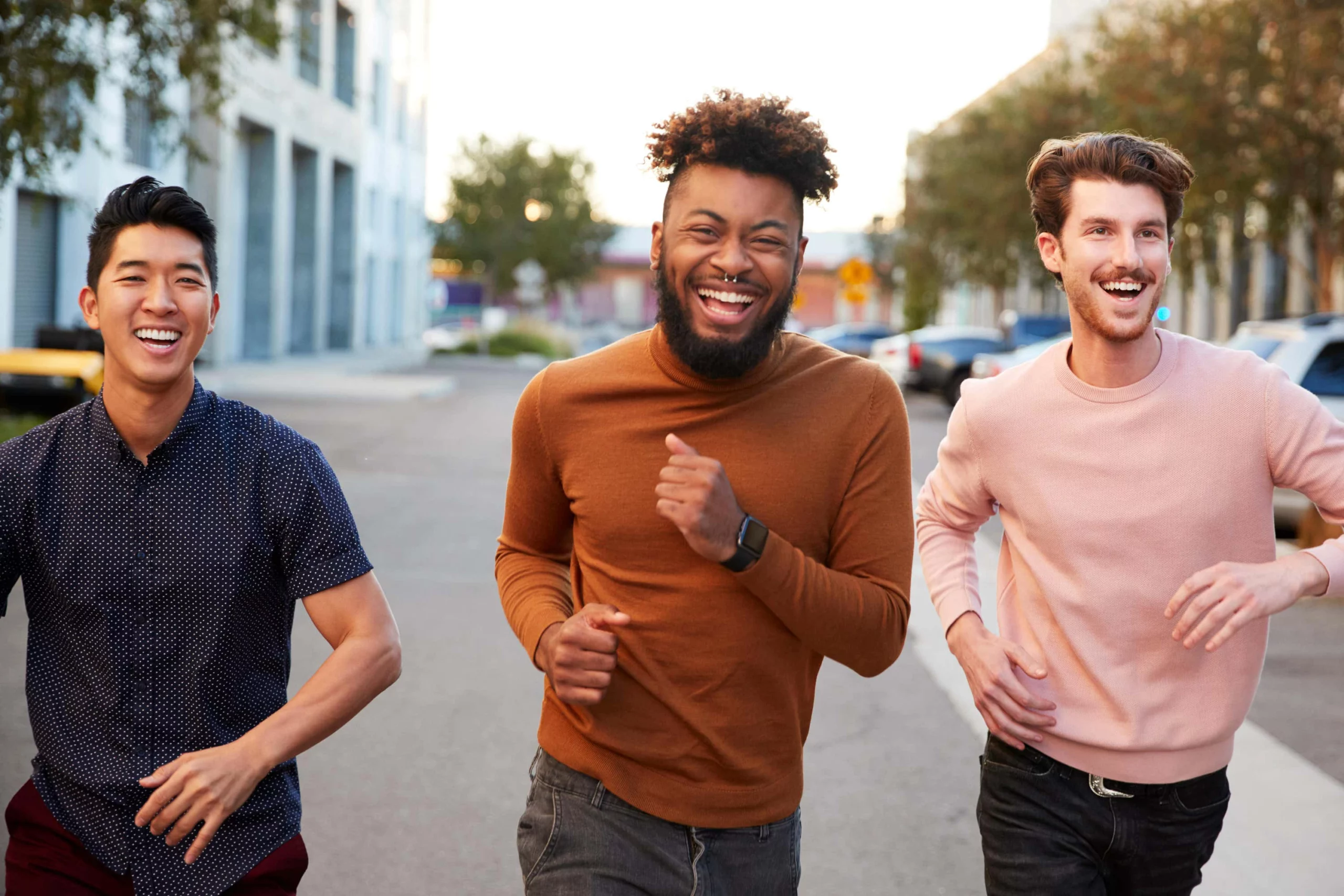 Men run laughing together scaled