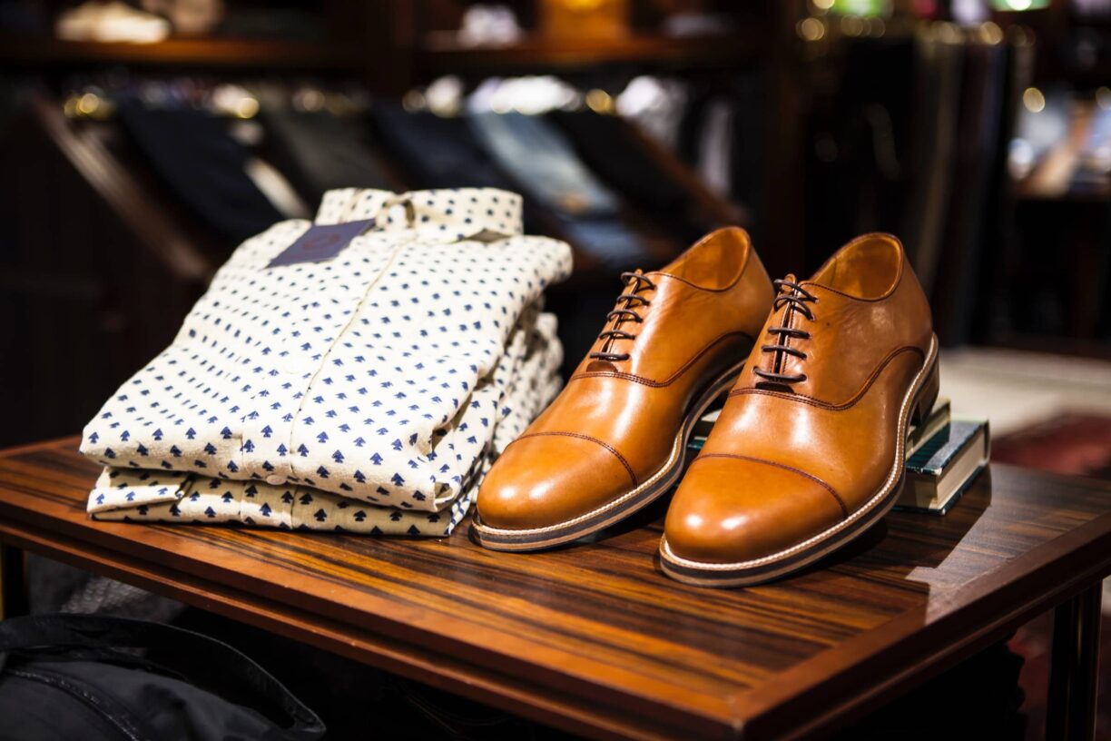 Shirt with nice brown shoes in shop