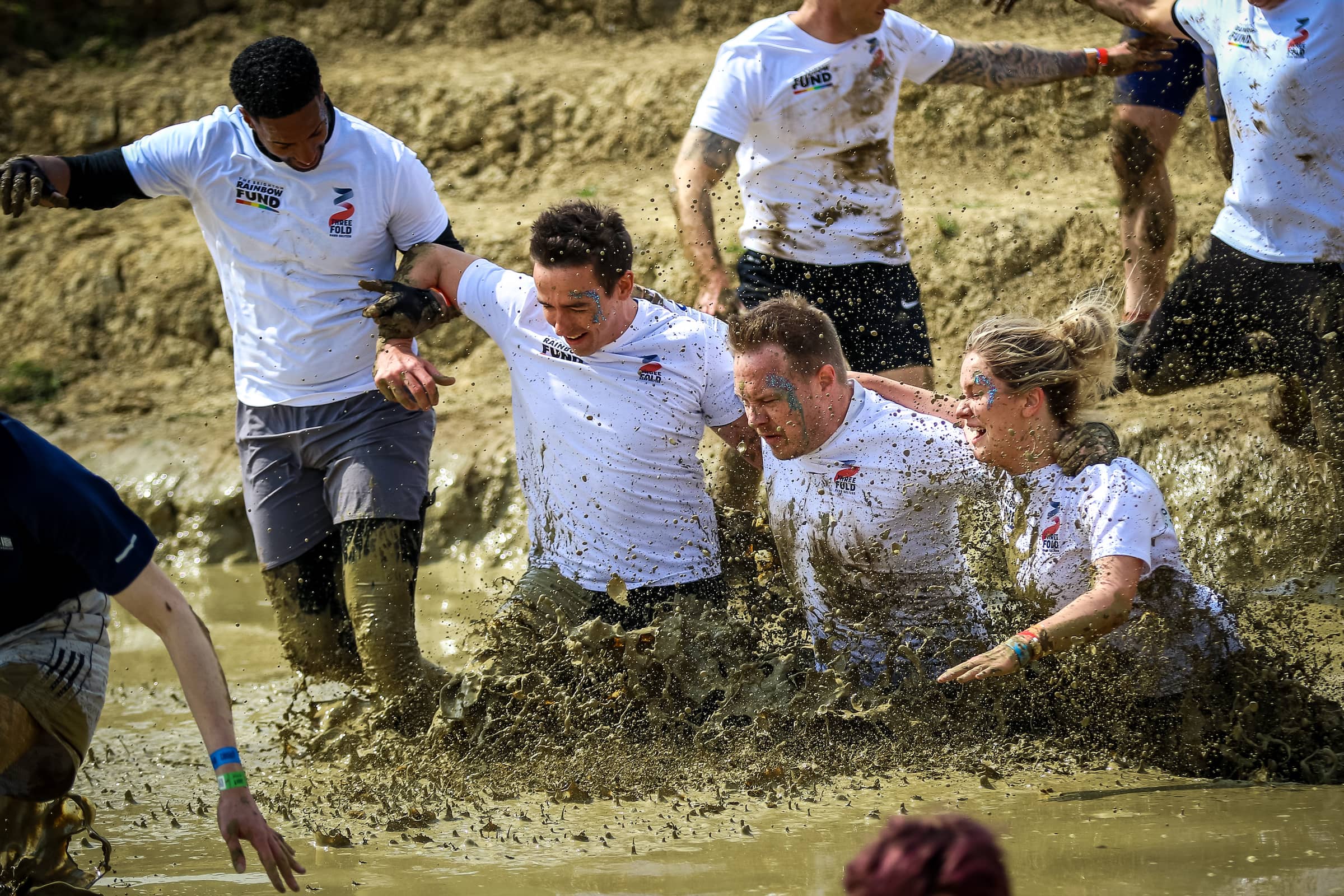 Tough mudder athletes in mud