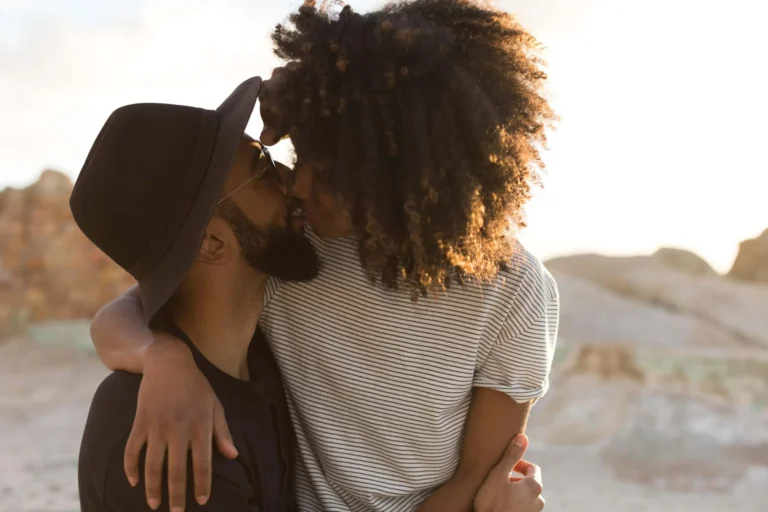 couple cuddle and kiss