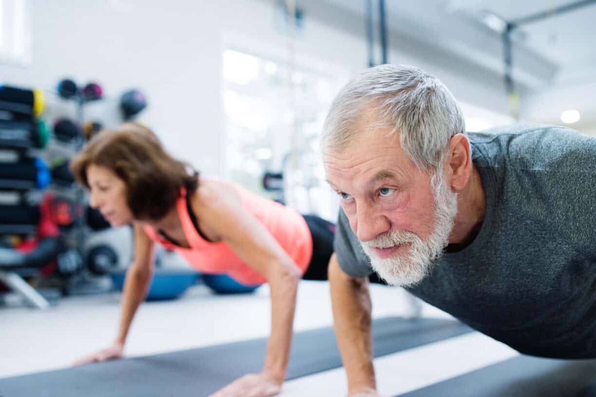 older couple do pushups