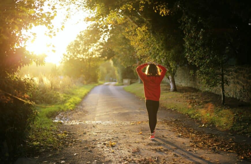 woman walks in sunset