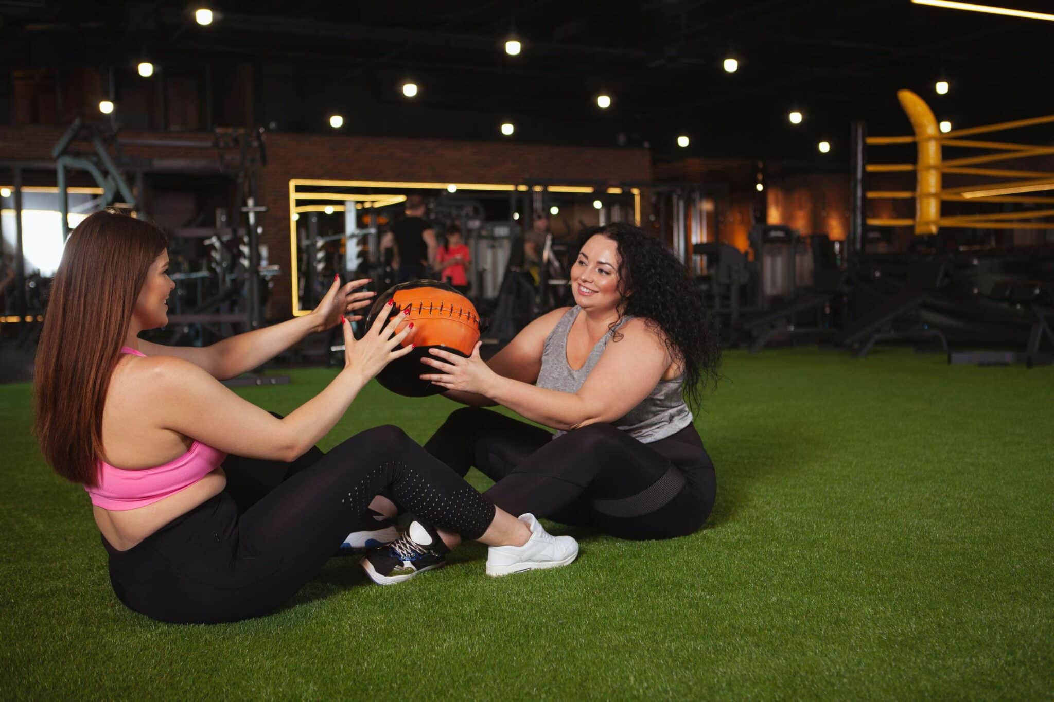 Women exercise together in the gym