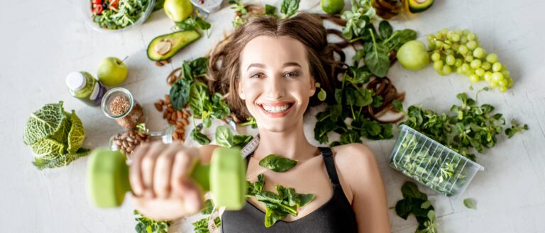 woman surrounded by various healthy food lying on the floor