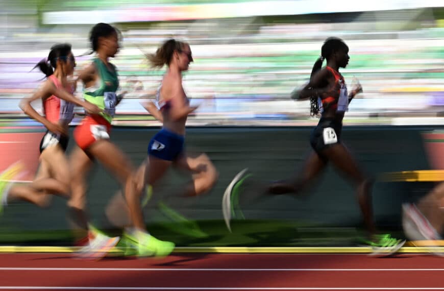 women athletes running on track