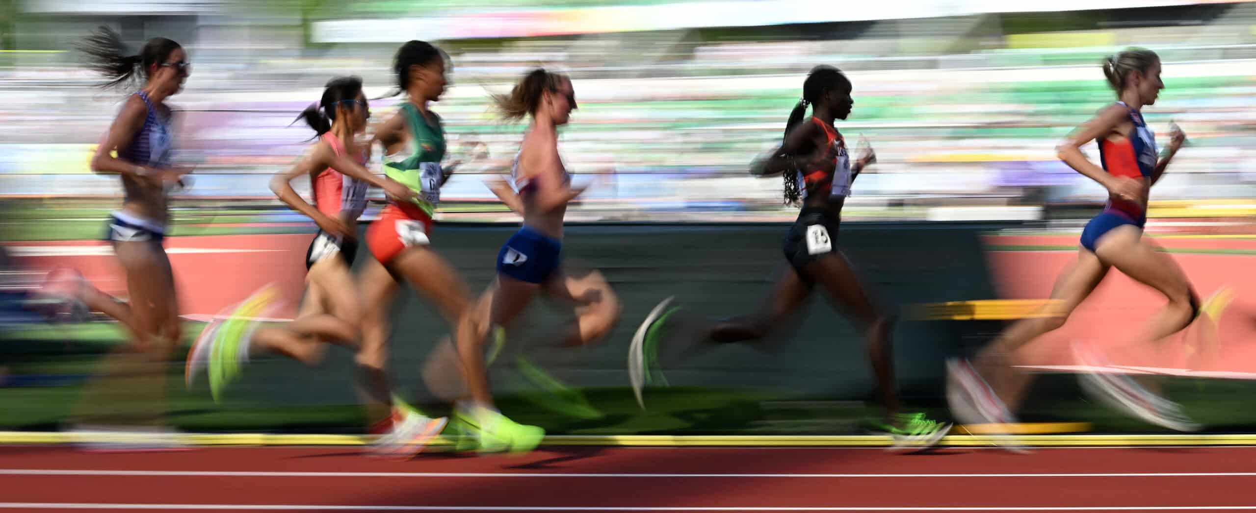 Women athletes running on track