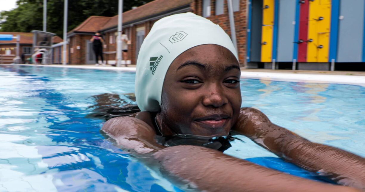 Young swimmer wearing adidas soul cap