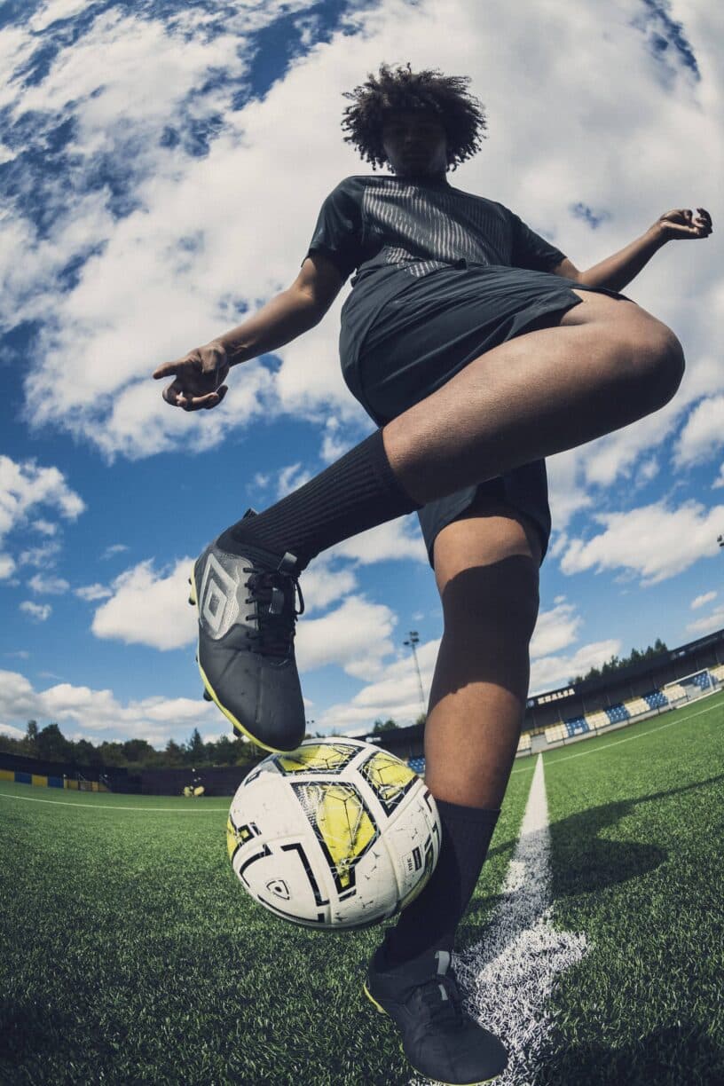 footballer juggles umbro football