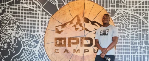 maro itoje next to under armour logo