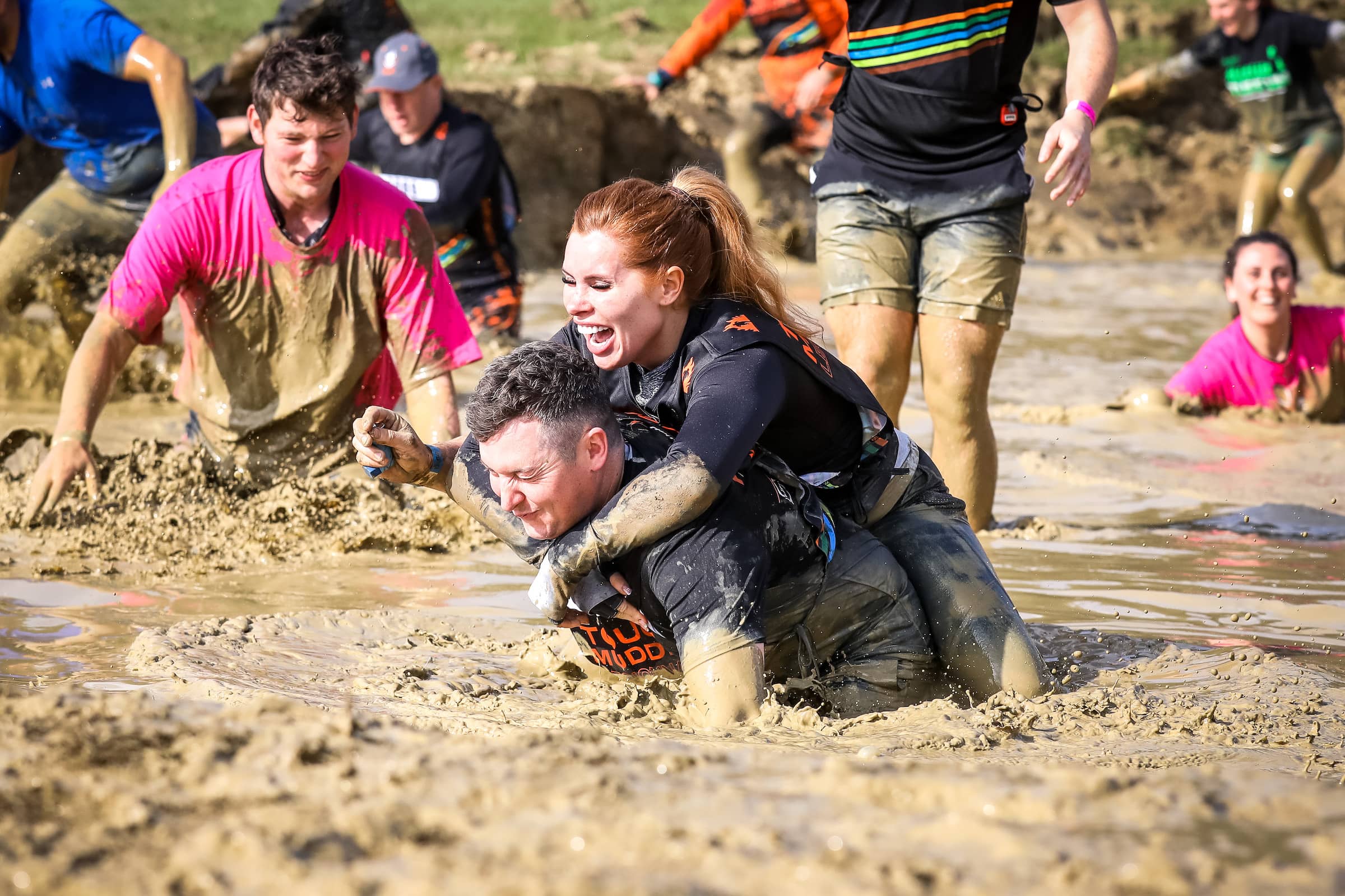 Tough mudder couple in mud