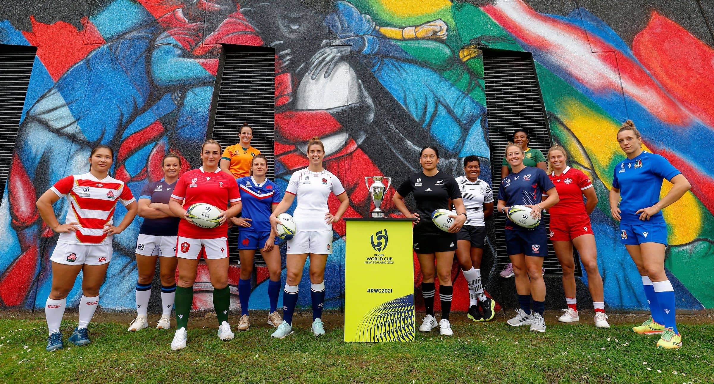 (l-r) rachel malcolm (scotland), saki minami (japan), siwan lillicrap (wales), shannon perry (australia), gaelle hermet (france), sarah hunter (england), kennedy simon (new zealand), sereima leweniqila (fiji), kate zackary (usa), nolusindiso booi (south africa), sophie de goede (canada) and elisa giordano (italy) pose in front of a mural specially created for the tournament during the rugby world cup 2021 captains' photocall at eden park on 2 october, 2022 in auckland, new zealand. (photo by hagen hopkins - world rugby/world rugby