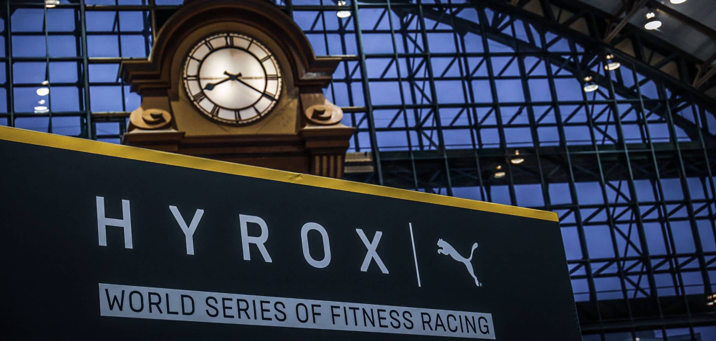 Hyrox logo below clock