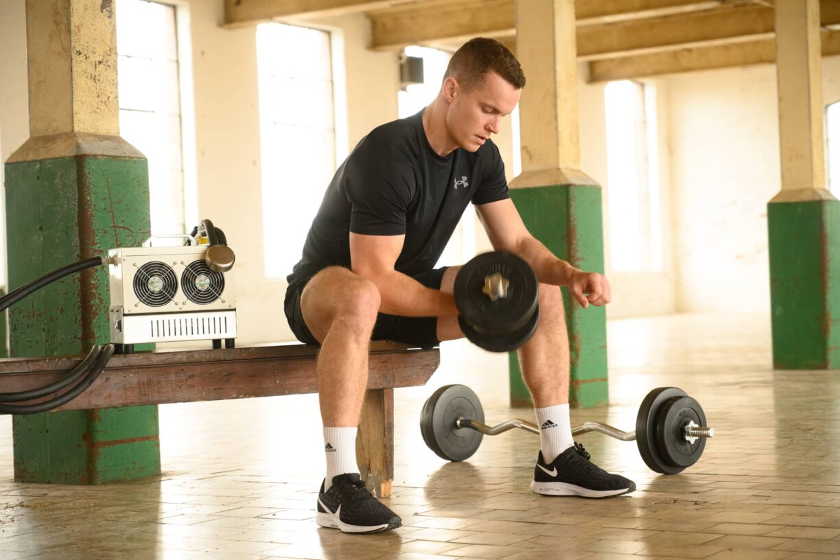 male athlete uses CoreTx GO Palm Cooling Device