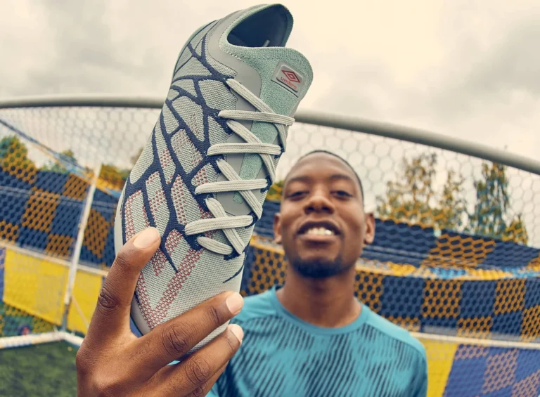 umbro influencer holds Velocita Alchemist boot