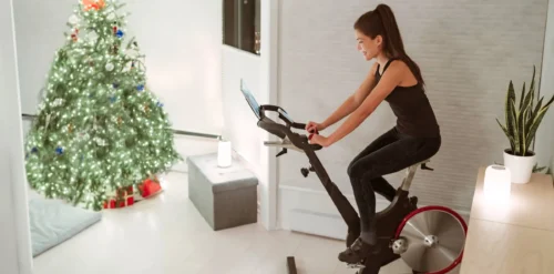 woman training indoors watching online video