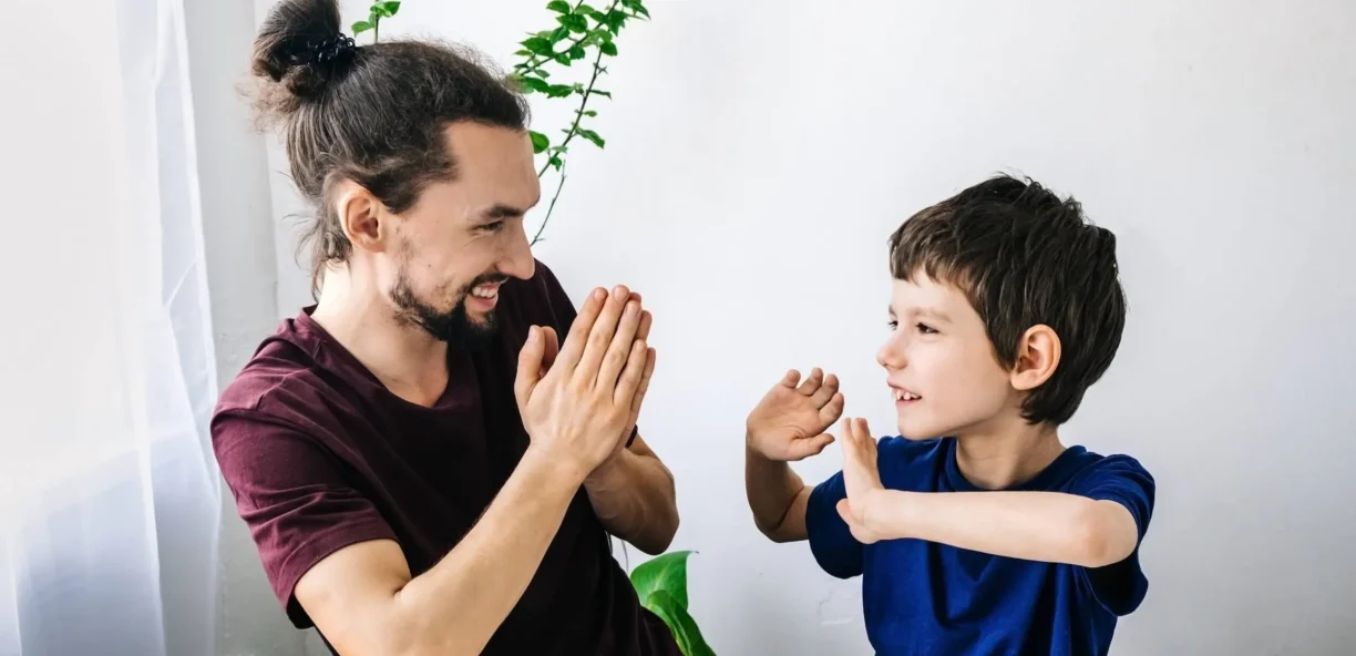 young autistic boy with carer