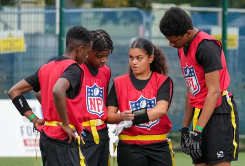 young people wearing nfl bibs