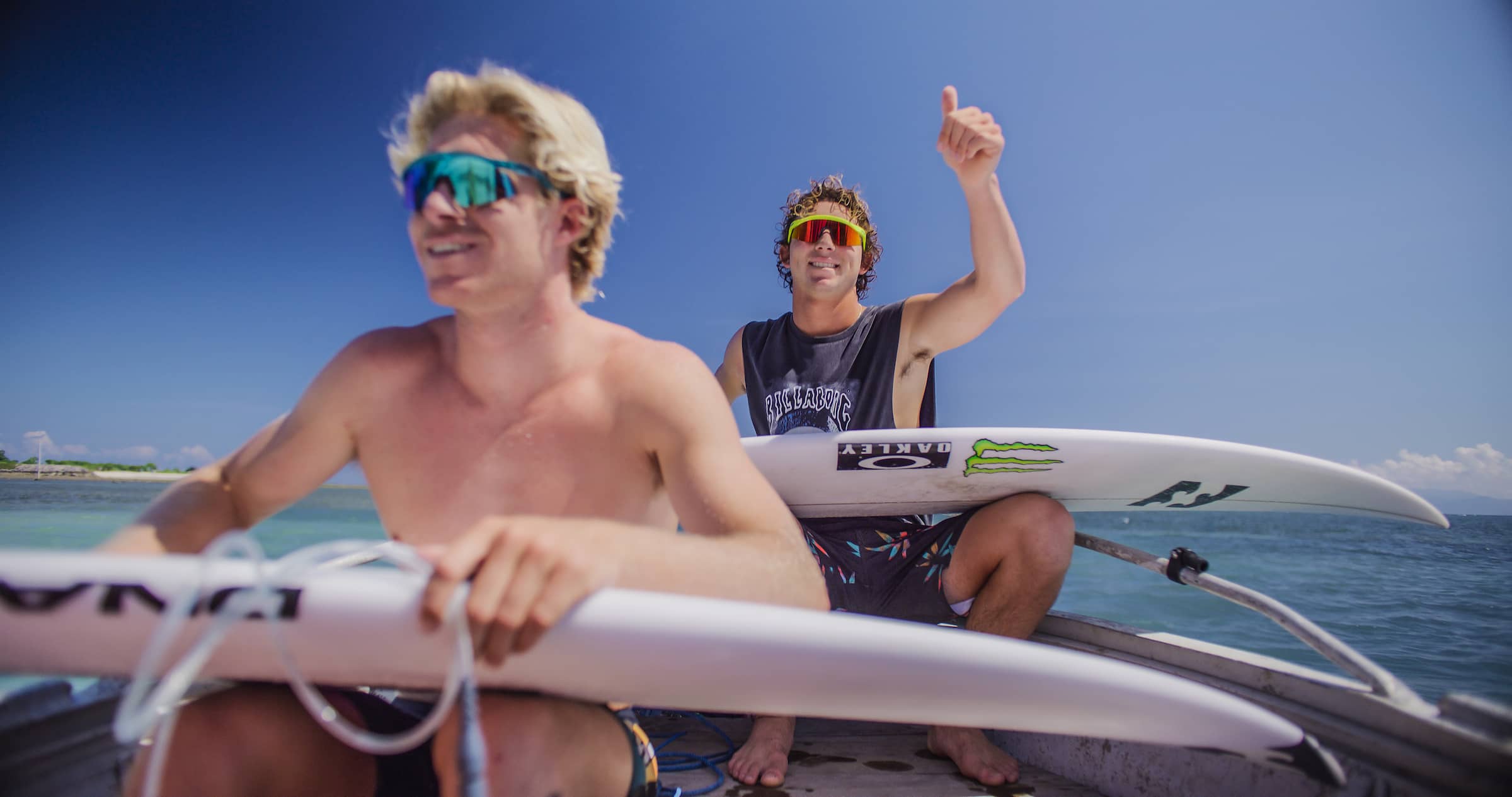 Young people wearing oakley hydra sunglasses on speedboat