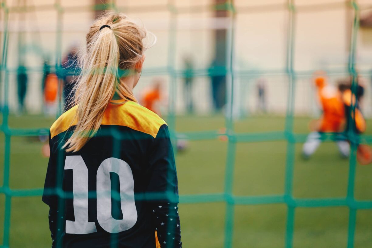 Youth female football team playing tournament match