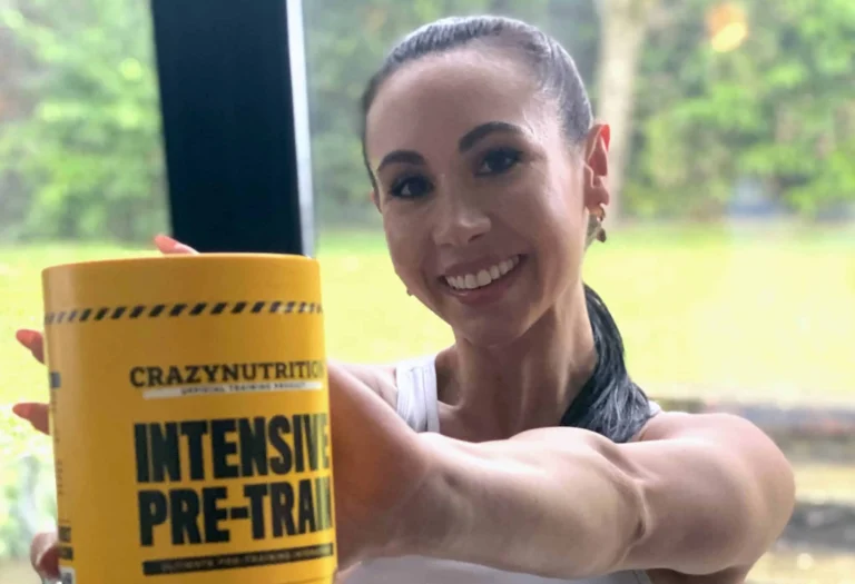 fit woman holds crazy nutrition supplement