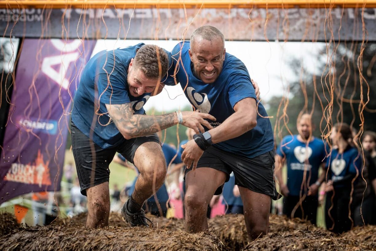 tough mudder men at the finish line