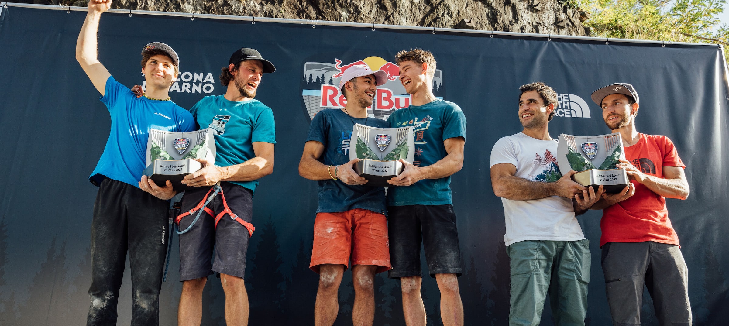 Winners celebrate on the podium at red bull dual ascent event in verzasca, switzerland on october 29th 2022