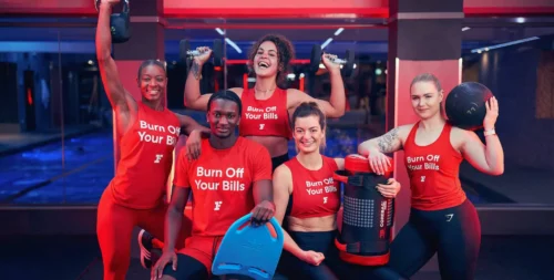 Fitness First trainers wear Burn Off Your Bills tees