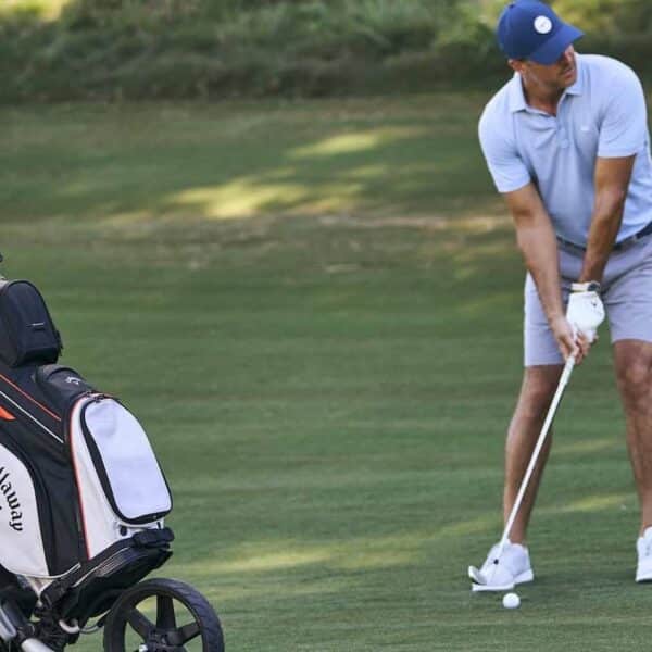 A golfer using callaway org 14 cart bag