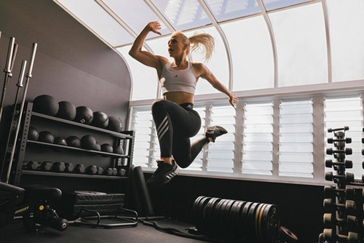 Les mills fitness woman jumps in air