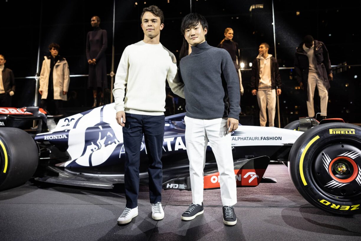 Scuderia AlphaTauri Formula One drivers Nyck De Vries and Yuki Tsunoda in front of the 2023 car