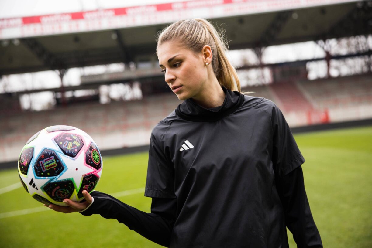 Jule Brand holding adidas football