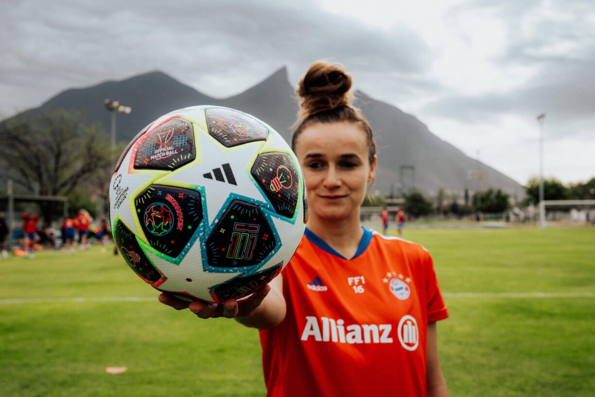 Lina Magull holds adidas football