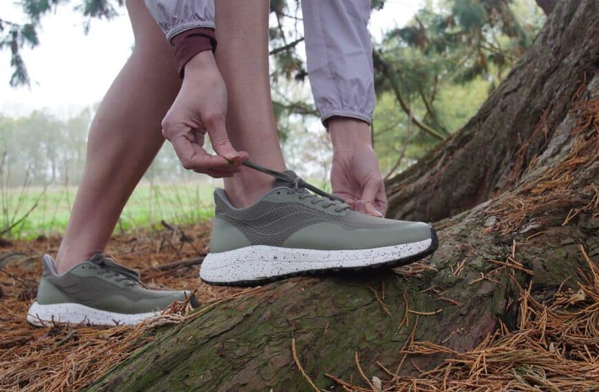 runner ties laces by a tree