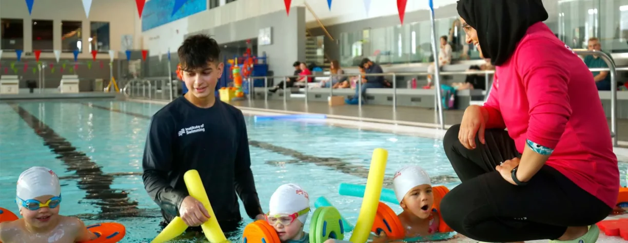 youngsters being taught to swim