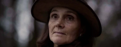 older lady stares into the distance