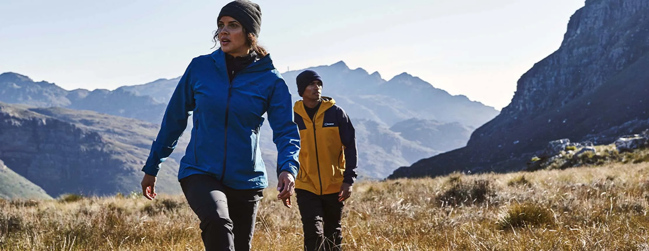 couple hike across the hills of the uk