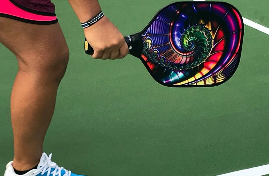 pickleball player with colourful paddle