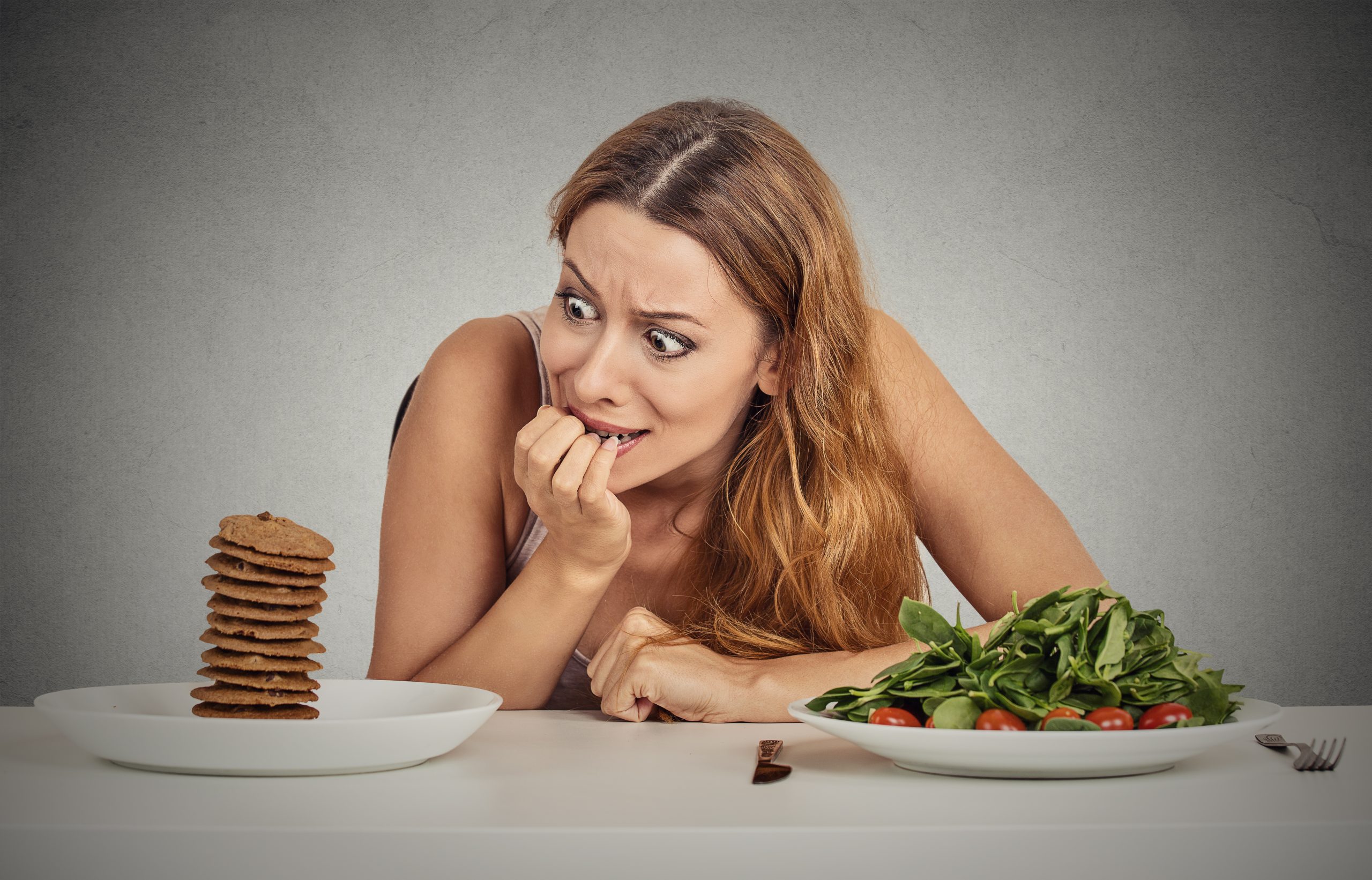 Woman looks fearful at food