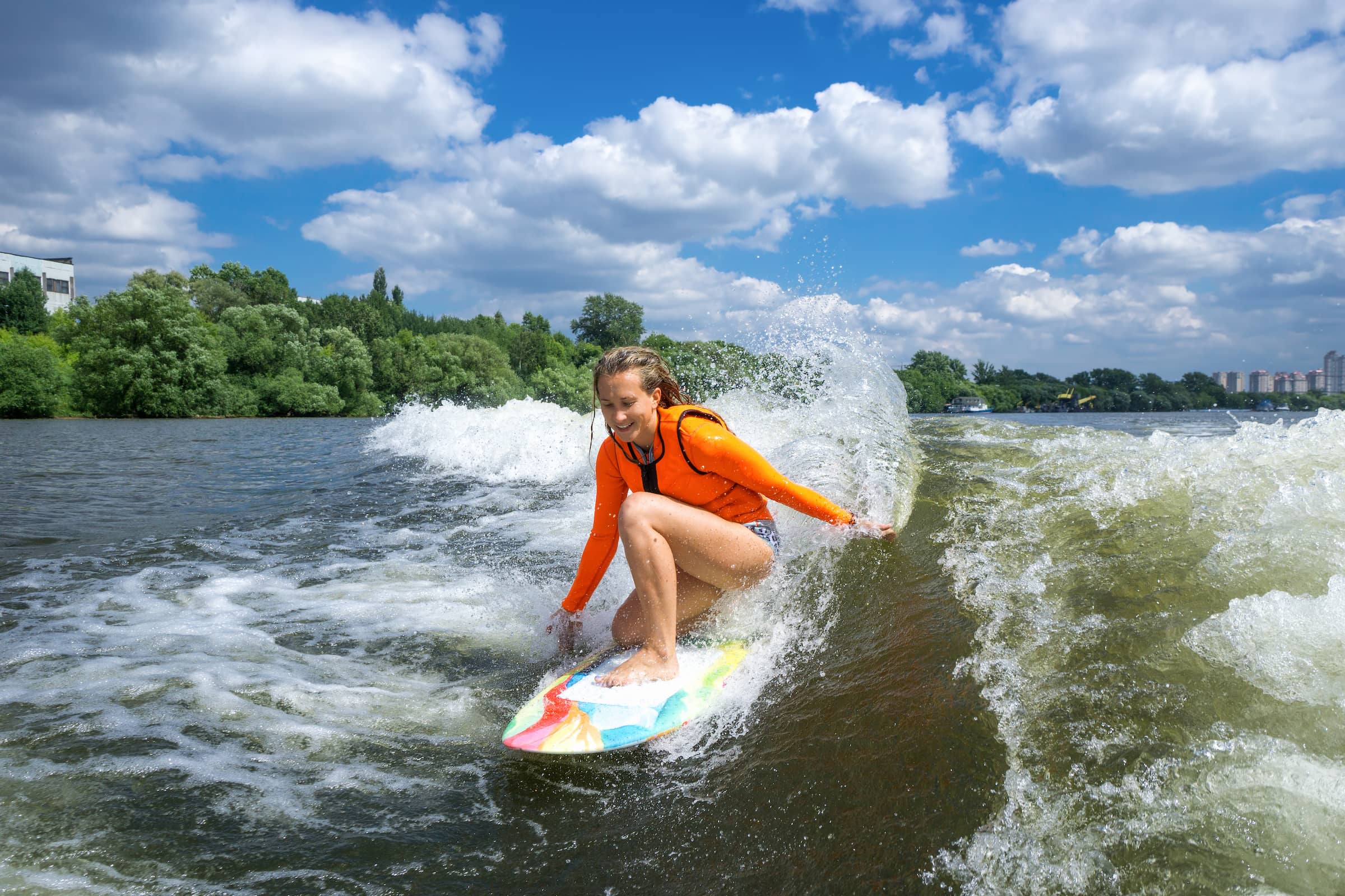 Young person wakesurfing