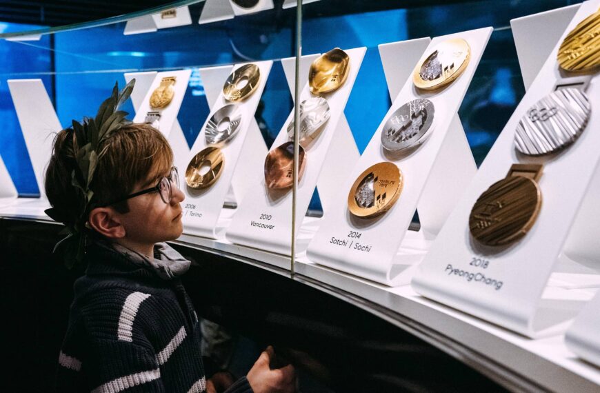 Child looks at medals in the olympic museum