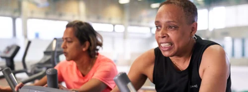 couple exercise on exercise bikes