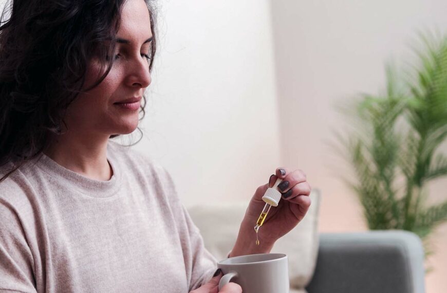 Woman taking cbd oil for anxiety treatment - Vitamins and supplements