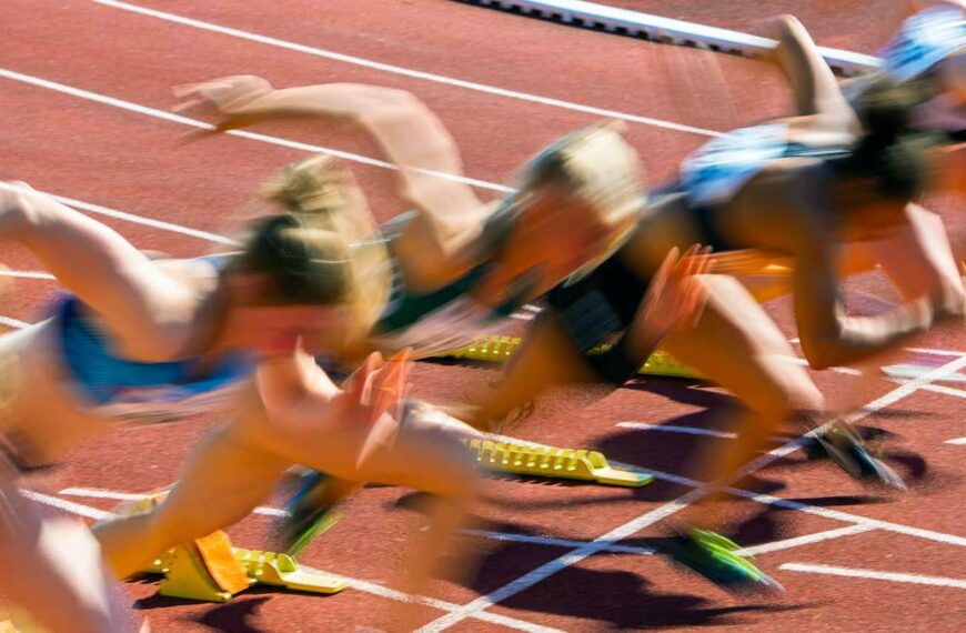blurred athletes on track start
