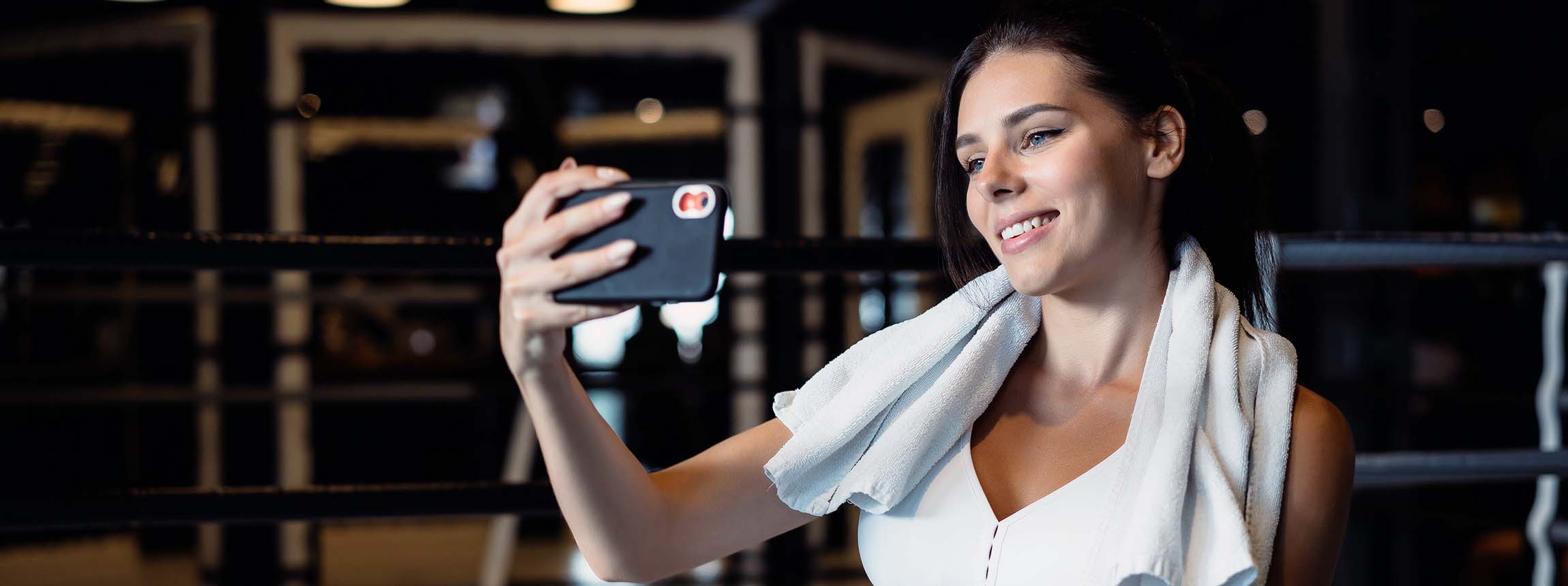 Sporty woman taking selfie with mobile phone social networks
