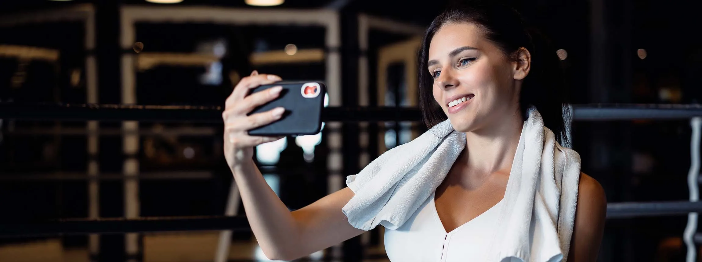 sporty woman taking selfie with mobile phone social networks